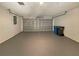 Spacious two car garage with auto door and painted concrete floor at 8812 Bayaud Dr, Tampa, FL 33626