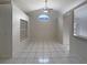 Bright and airy living area with high ceilings, tile floors, and easy access to the kitchen and dining areas at 8812 Bayaud Dr, Tampa, FL 33626