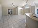Spacious living room boasts tile floors, plenty of natural light, and easy access to other areas of the home at 8812 Bayaud Dr, Tampa, FL 33626