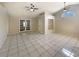 Bright living area with tile floors, high ceilings, and a seamless transition to other living spaces at 8812 Bayaud Dr, Tampa, FL 33626