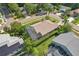 Beautiful backyard view of the screened-in pool and tropical landscaping offering privacy, a relaxing outdoor space at 892 Crestridge Cir, Tarpon Springs, FL 34688