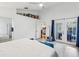 A simple, well-lit bedroom with access to the bathroom and backyard, offers comfort and functionality at 892 Crestridge Cir, Tarpon Springs, FL 34688