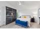 Bright bedroom with a minimalist aesthetic, a spacious wardrobe, and a blue bench at the foot of the bed at 892 Crestridge Cir, Tarpon Springs, FL 34688
