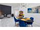 Bright dining room featuring modern lighting, stylish decor, and comfortable seating around a sleek oval table at 892 Crestridge Cir, Tarpon Springs, FL 34688