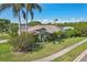 Beautiful single-Gathering home with lush landscaping, well-maintained lawn, and inviting facade at 892 Crestridge Cir, Tarpon Springs, FL 34688