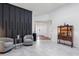 Inviting foyer with sleek tile floors, modern decor, and a view of the front door at 892 Crestridge Cir, Tarpon Springs, FL 34688