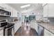 Modern kitchen with granite countertops, stainless steel appliances, and eat-in dining area at 892 Crestridge Cir, Tarpon Springs, FL 34688