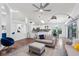 Spacious living room featuring hardwood floors, recessed lighting, a ceiling fan, and an open-concept design at 892 Crestridge Cir, Tarpon Springs, FL 34688