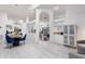 Open-concept living area with stylish tile floors, modern lighting, and seamless flow between living spaces at 892 Crestridge Cir, Tarpon Springs, FL 34688