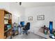 Bright home office featuring dual desk setup, functional shelving, and ample natural light for productive work at 892 Crestridge Cir, Tarpon Springs, FL 34688