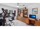 Functional home office with ample storage, a wooden bookshelf, and a comfortable desk setup for productivity at 892 Crestridge Cir, Tarpon Springs, FL 34688