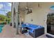 Comfortable outdoor seating area on covered patio, ideal for poolside relaxation and entertainment at 892 Crestridge Cir, Tarpon Springs, FL 34688