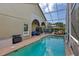 Enjoy the screened pool, patio, and outdoor living space for year-round enjoyment at 892 Crestridge Cir, Tarpon Springs, FL 34688