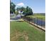 Spacious backyard featuring a stock tank pool, waterfront views, and well-maintained lawn at 10142 118Th Ave, Largo, FL 33773