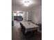 Cozy dining area adjacent to living room, ideal for Gathering meals and entertaining guests at 10142 118Th Ave, Largo, FL 33773