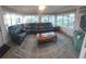 Comfortable sunroom with large windows offering picturesque views and natural light at 10142 118Th Ave, Largo, FL 33773