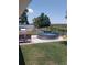 Backyard featuring a stock tank pool, patio furniture, and waterfront views at 10142 118Th Ave, Largo, FL 33773