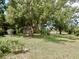 This sprawling green backyard is perfect for entertaining with privacy landscaping, and a storage shed at 10308 Fore Dr, Tampa, FL 33612