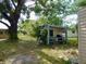 Open-air potting shed or outdoor kitchenette featuring the backyard at 10308 Fore Dr, Tampa, FL 33612