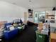 Spacious bonus room with sliding glass doors and built-in shelves for storage and organization at 10308 Fore Dr, Tampa, FL 33612