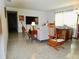 Cozy living room featuring terrazzo flooring, and comfortable furniture at 10308 Fore Dr, Tampa, FL 33612