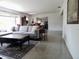 Bright living room with a comfortable gray sofa, table, and rug at 10308 Fore Dr, Tampa, FL 33612