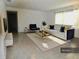 Inviting living room features a white sofa, area rug, and modern decor at 10308 Fore Dr, Tampa, FL 33612