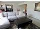 Neutral living area with a comfortable couch, rug, and coffee table at 10308 Fore Dr, Tampa, FL 33612