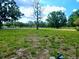 This large grassy lot boasts mature trees, a sidewalk, and street access, making it perfect for building your dream home at 10308 Fore Dr, Tampa, FL 33612