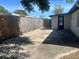 Private backyard includes a spacious concrete patio and tall wooden fence for added seclusion and privacy at 10367 109Th Ave, Largo, FL 33773