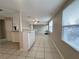 The kitchen has bright lighting, tiled floor, and an open layout for easy serving and entertaining at 10367 109Th Ave, Largo, FL 33773