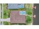 Aerial view of a home with pool and access to the lake at 10641 Cory Lake Dr, Tampa, FL 33647