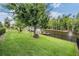 The lush back yard overlooks a beautiful lake with a private dock at 10641 Cory Lake Dr, Tampa, FL 33647