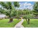 The back yard features a walkway down to the lake and a private dock at 10641 Cory Lake Dr, Tampa, FL 33647