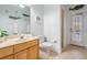 Charming bathroom with a single sink, marble countertop and decor accents at 10641 Cory Lake Dr, Tampa, FL 33647