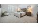 Neutral bedroom with shuttered windows, soft carpet and comfortable furniture at 10641 Cory Lake Dr, Tampa, FL 33647