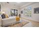 Bright bedroom featuring natural light, with sliding door access to the outdoor pool at 10641 Cory Lake Dr, Tampa, FL 33647