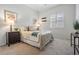 Cozy bedroom with window shutters, side tables and lamps at 10641 Cory Lake Dr, Tampa, FL 33647