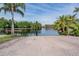 Community boat ramp for launching small boats and watercraft, surrounded by lush tropical landscaping in a tranquil environment at 10641 Cory Lake Dr, Tampa, FL 33647