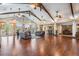 Clubhouse interior with vaulted ceilings, hardwood floors, seating and bar area; ideal for community events and socializing at 10641 Cory Lake Dr, Tampa, FL 33647