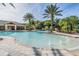 The community pool features lush landscaping, fountains, lounge seating and easy access stairs at 10641 Cory Lake Dr, Tampa, FL 33647
