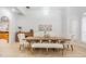 Dining room with modern chandelier, table and seating with lots of natural light at 10641 Cory Lake Dr, Tampa, FL 33647