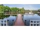 Dock on the water in a beautiful lake community; a lovely place to relax, boat, and fish from the dock at 10641 Cory Lake Dr, Tampa, FL 33647