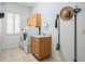 Practical laundry room with modern washer, dryer and sink at 10641 Cory Lake Dr, Tampa, FL 33647