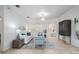 Bright living room with a comfortable sofa, stylish seating, and an open view to the dining area at 10641 Cory Lake Dr, Tampa, FL 33647