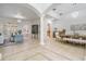 Open living space showcasing elegant tile flooring, an archway, and a view of the dining area at 10641 Cory Lake Dr, Tampa, FL 33647