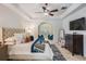 Serene main bedroom boasts a decorative ceiling fan, comfortable seating, and a relaxing atmosphere at 10641 Cory Lake Dr, Tampa, FL 33647
