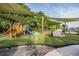 Outdoor playground features colorful slides, climbing structures, and covered seating perfect for hours of fun in a Gathering friendly area at 10641 Cory Lake Dr, Tampa, FL 33647
