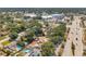 Expansive aerial view of a residential neighborhood with mature trees and a nearby commercial area at 1117 Tyrone N Blvd, St Petersburg, FL 33710