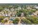 Aerial view of the home nestled within a tree-lined neighborhood featuring backyard space at 1117 Tyrone N Blvd, St Petersburg, FL 33710